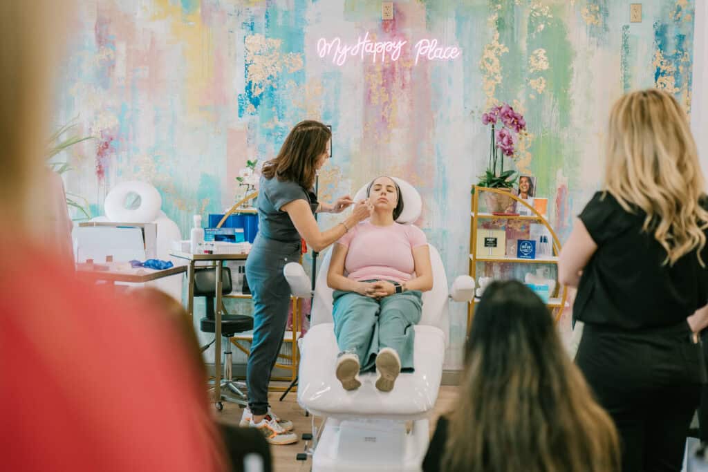 Patient receiving Sculptra with cannula + post-treatment glow portrait