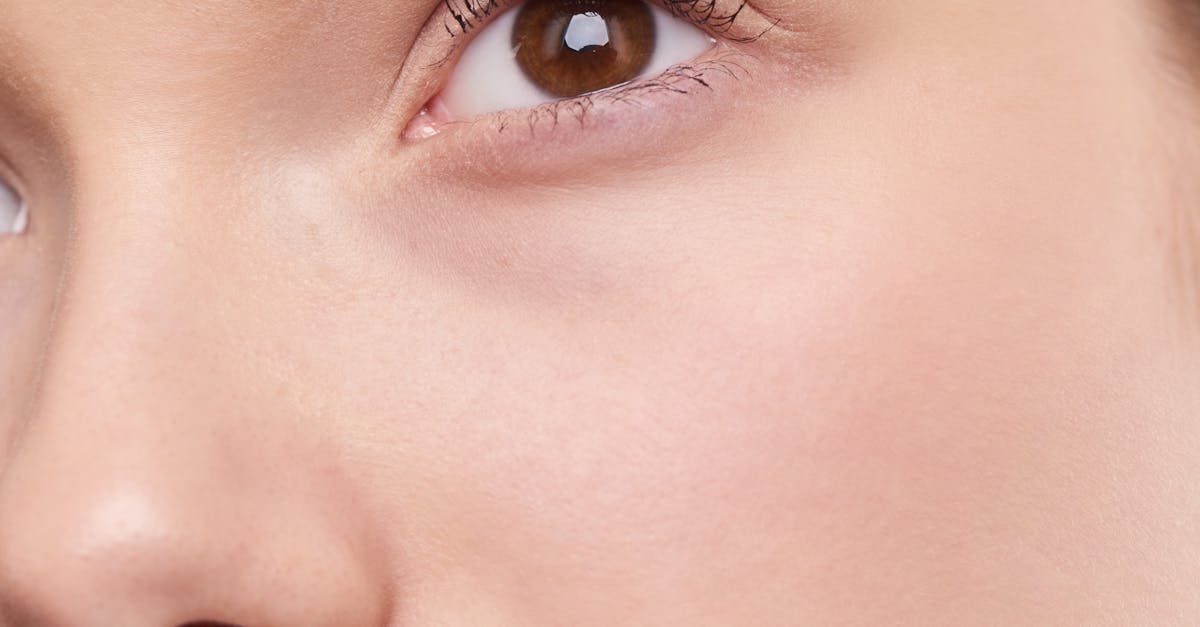 Close-up portrait capturing the natural beauty and smooth skin of a young woman.